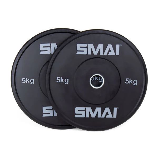 Two black bumper plates from the "80kg HD Bumper Plate Set inc 20kg Barbell," marked with "5 kg" and "Sale Item" in white text. The plates, perfect for CrossFit or Olympic lifting, are stacked slightly overlapping and include a silver center ring.