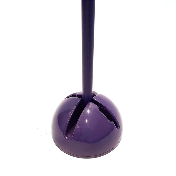 A purple plunger with a round base, similar to the Agility Pole by No Sync To Channel Engine, stands upright against a white background. The handle is inserted into the ventilated base.