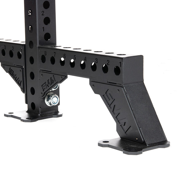 Close-up of the SMAI Vanta Series Rack Legs in black metal, featuring numbered holes and a sturdy support design. The Rack Legs are bolted to a base, highlighting their robust construction for stability.