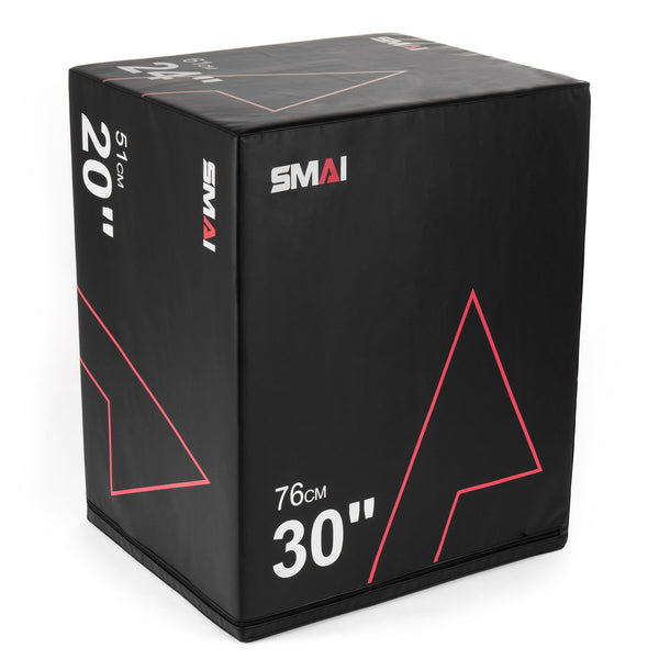 The "Plyometric Box - Pre-Assembled" by SMAI is a sturdy black foam box featuring red and white markings, designed to ensure athlete safety. It provides adjustable heights of 20, 24, and 30 inches, with red line accents for versatile training.