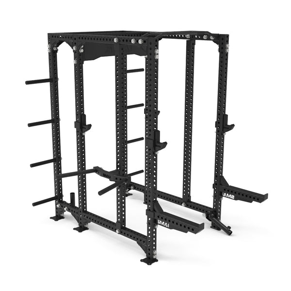 A black power rack featuring SMAI's Safety Spotter Arms from the Vanta Series, equipped with a quick release safety pin system. It offers numerous adjustable components, weight storage pegs, and a robust perforated frame with nylon protection, making it ideal for home or gym use and perfect for exercises such as squats and bench presses.