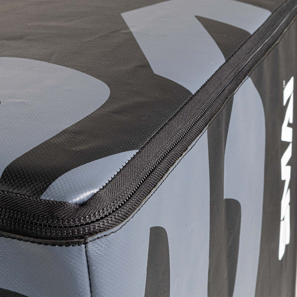 Close-up of a padded surface showcasing the black and gray geometric design of the Plyometric Box - WOD Pro by SMAI. A black zipper outlines its edges, accentuating the boxy form of this competition-grade plyometric box and providing contrast to its sleek EVA foam texture.