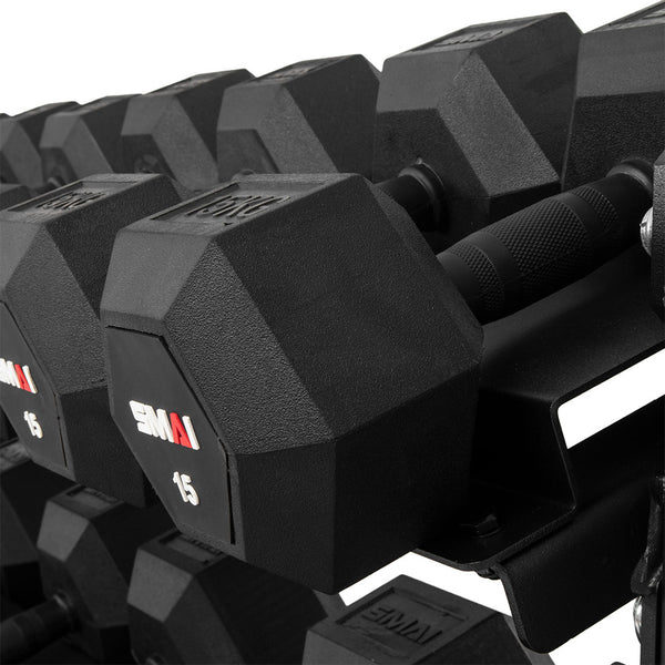 Detail of rubber hex dumbbell resting on a storage shelf