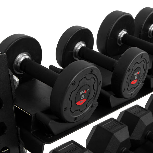 A set of black dumbbells is placed on the SMAI 1.1m Dumbbell Storage Shelf - Vanta Series. The weights prominently feature a bold red number 5 on a central disc. Constructed from sleek, modern materials, the rack includes 11 gauge steel and rubber-coated surfaces for superb grip.