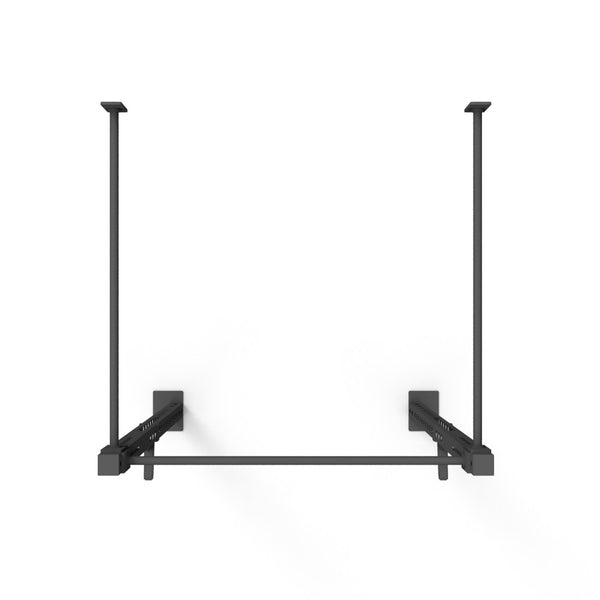 Introducing the Wall Mounted Rig - 1 Squat Cell - X-Frame by No Sync To Channel Engine, a ceiling-mounted black metal unit with two vertical supports and a horizontal bar, perfect for hanging or storage. Its modular X-Frame features a minimalist design set against a white background, making it ideal for those seeking versatile and stylish commercial equipment.