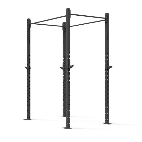 The Rig - 2 Squats Cells - X-Frame by No Sync To Channel Engine is a black metal power rack constructed from high-gauge steel tubing. It includes adjustable hooks and dual pull-up bars, ideal for strength training in a commercial gym setting. The structure is supported by four sturdy posts and features numerous pre-drilled holes for customization.