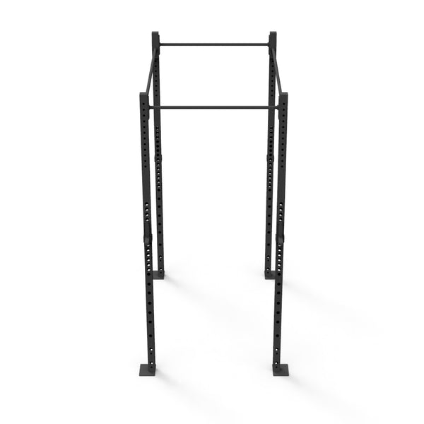 The Rig - 2 Squats Cells - X-Frame by No Sync To Channel Engine is a black power rack crafted from high-gauge steel tubing. It includes adjustable holes for customizing height settings and features a pull-up bar at the top. This equipment is ideal for weightlifting and strength training, making it perfect for both personal home workouts and commercial gym use.