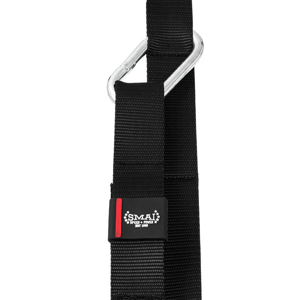 Close-up of a black adjustable strap featuring a silver carabiner, perfect for wooden gym rings. Includes a small "SMAI" logo tag. Product: Wooden Gym Rings - Easy Straps.